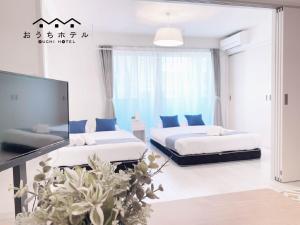Postel nebo postele na pokoji v ubytování OUCHI HOTEL Miyajimaguchi