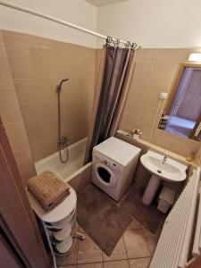 a bathroom with a sink and a toilet and a shower at Gozsdu Apartment in Budapest