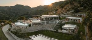 an aerial view of a mansion in the mountains at Agriturismo Podere Pansera in Petrizzi