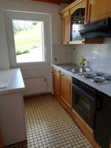 Kuchyň nebo kuchyňský kout v ubytování Chalet Waldrand