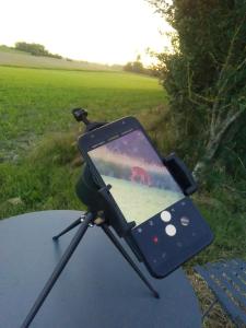 a tablet sitting on top of a table in a field at La BerryCurienne proche du Zoo de Beauval Saint-Aignan avec SDB, WC ET SPA PRIVATIF pour chaque chambre in Luçay-le-Mâle