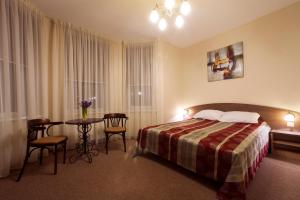 Postel nebo postele na pokoji v ubytování Dzintars Hotel