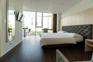 Postel nebo postele na pokoji v ubytování Los Lorentes Hotel Bern Airport