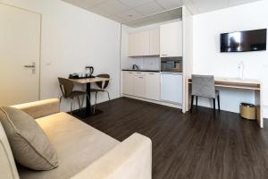 Kuchyň nebo kuchyňský kout v ubytování Los Lorentes Hotel Bern Airport