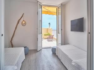 Кровать или кровати в номере Hotel Medusa