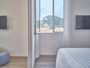 Кровать или кровати в номере Hotel Medusa