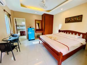 Postel nebo postele na pokoji v ubytování Benwadee Resort Pattaya