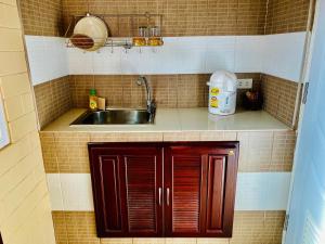 Kuchyň nebo kuchyňský kout v ubytování Benwadee Resort Pattaya