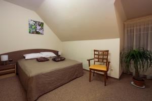 Postel nebo postele na pokoji v ubytování Dzintars Hotel