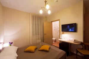 Postel nebo postele na pokoji v ubytování Dzintars Hotel