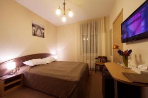 Postel nebo postele na pokoji v ubytování Dzintars Hotel