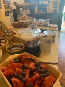 a table with a bowl of food on a table at Country house sant alfonso in Furore