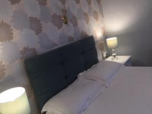 A bed or beds in a room at Barbon Inn