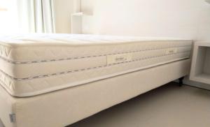 A bed or beds in a room at Hotel Carducci