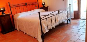 Ліжко або ліжка в номері Casina di Pacina