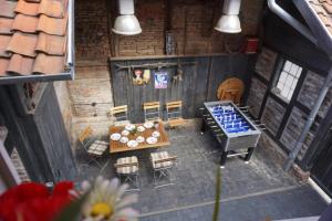 an overhead view of a house with a table and chairs at Altstadtperle Wernigerode in Wernigerode