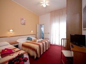 Postel nebo postele na pokoji v ubytování Villa Silvie Rose