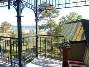 a balcony with a view of the ocean at Villa Strandblick in Binz