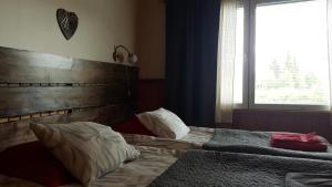 Een bed of bedden in een kamer bij Hotel Seita