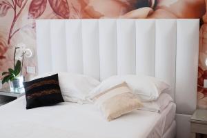 Postel nebo postele na pokoji v ubytování Hotel Stella D'Oro