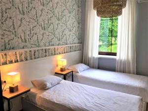 Posteľ alebo postele v izbe v ubytovaní Sztygarka. Pensjonat Pod Wieżą Katowice Chorzów