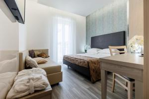 TV a/nebo společenská místnost v ubytování Hotel Stella D'Oro