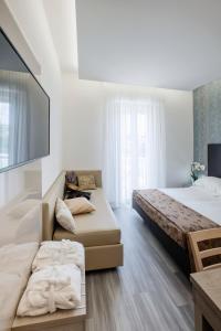 Postel nebo postele na pokoji v ubytování Hotel Stella D'Oro