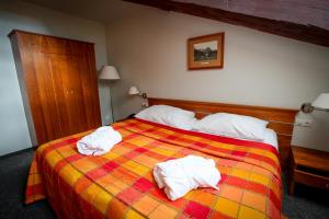 Łóżko lub łóżka w pokoju w obiekcie LH Hotel Dvořák Tábor Congress & Wellness