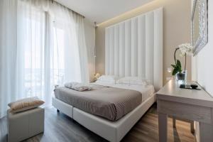 Postel nebo postele na pokoji v ubytování Hotel Stella D'Oro