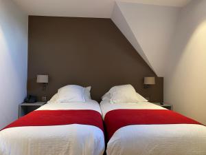 Ένα ή περισσότερα κρεβάτια σε δωμάτιο στο Hotel New Regina