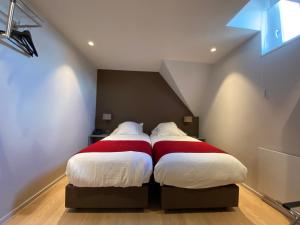 Ένα ή περισσότερα κρεβάτια σε δωμάτιο στο Hotel New Regina