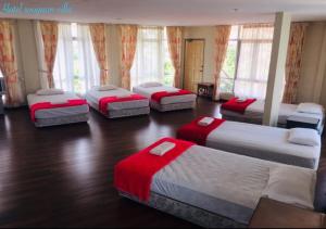 Soo Guan Villa tesisinde bir odada yatak veya yataklar