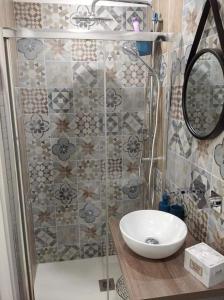 a bathroom with a sink and a shower at Mattia's house 2 in Bari +26 photos