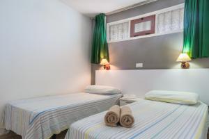 Postel nebo postele na pokoji v ubytování Alsol Nara