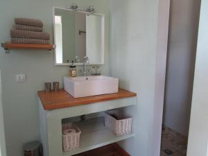 a bathroom with a sink and a mirror at Casa Pura Vida in Villanueva de Algaidas +46 photos