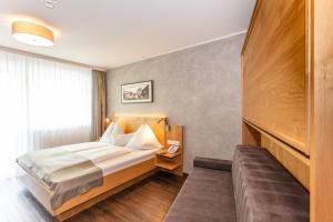 Katil atau katil-katil dalam bilik di Hotel Almrausch