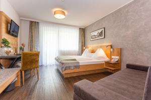 Katil atau katil-katil dalam bilik di Hotel Almrausch