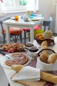 a table with bread and other food on it at La Vecchia Latteria - B & B in Gardone Riviera