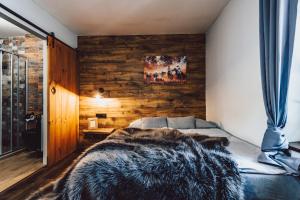 Postel nebo postele na pokoji v ubytování Resort Mlýn Černovice