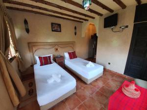 Cama o camas de una habitación en Dar Assarou - Toubkal National Park Lodge
