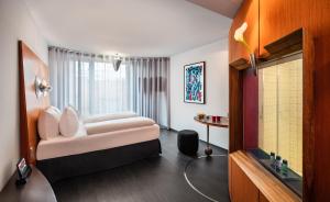 Postel nebo postele na pokoji v ubytování Penck Hotel Dresden + 21 fotografií