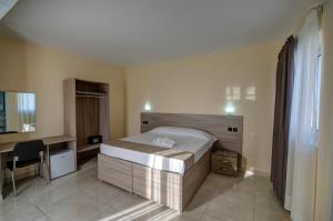 Postel nebo postele na pokoji v ubytování Allegro Hotel
