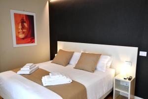 Postel nebo postele na pokoji v ubytování Nina B&B