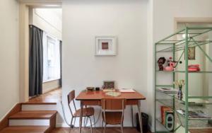 a dining room with a table and a shelf at House in House at the Heart of Exarchia, extremely central in Athens