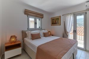 Postel nebo postele na pokoji v ubytování Euphoria House