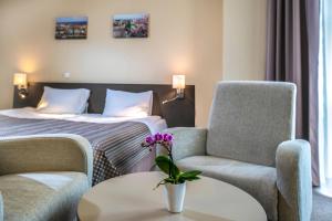 Postel nebo postele na pokoji v ubytování Corvin Hotel Budapest Corvin Wing