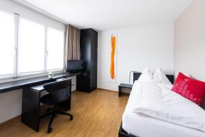 Ένα ή περισσότερα κρεβάτια σε δωμάτιο στο Hotel Bauernhof - Self Check-In Hotel