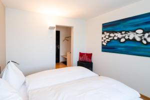 Ένα ή περισσότερα κρεβάτια σε δωμάτιο στο Hotel Bauernhof - Self Check-In Hotel