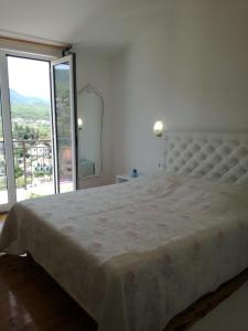 Postel nebo postele na pokoji v ubytování Apartmani Mladina