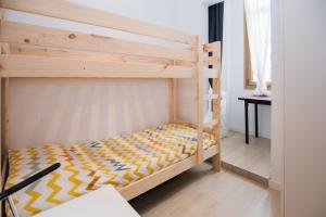 Posteľ alebo postele v izbe v ubytovaní LA SURFERA APARTMENT